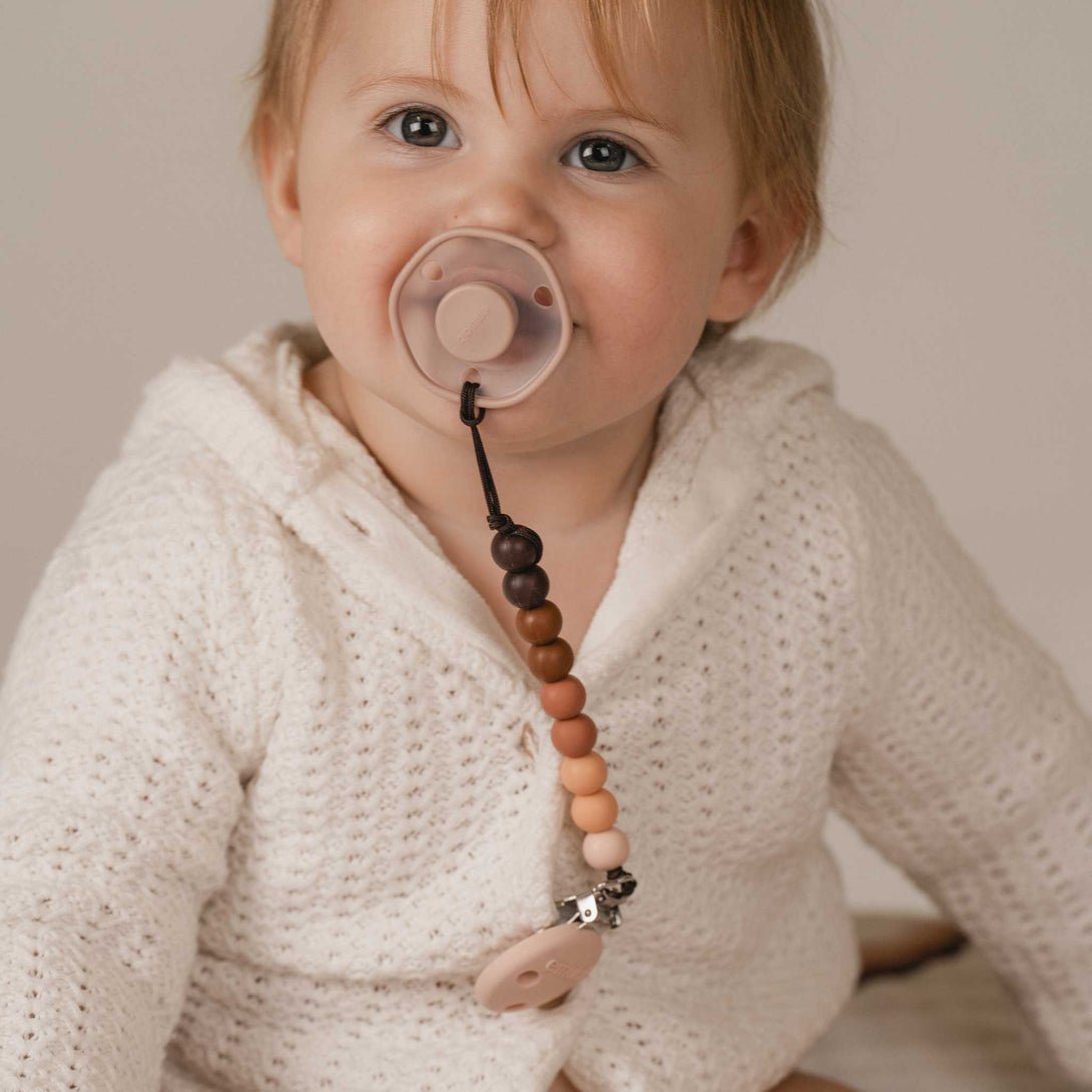 Baby with Rose Emulait Pacifier and Pacifier Clip